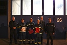 Gruppenbild der Helfer mit Bürgermeister Reißer (2.v.rechts i.B.), Stv. Amtsleiter der Feuerwehr Darmstadt Jens Rönnfeld (links i.B.) und Ortsbeauftragten Andreas Würsching (rechts i.B.)